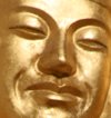 Buddhist gold leaf face smiling